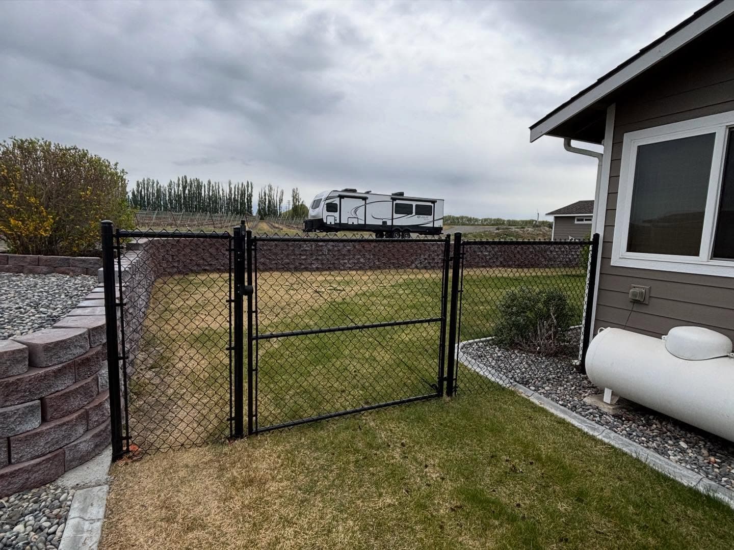 Black chain link perimeter fence installation